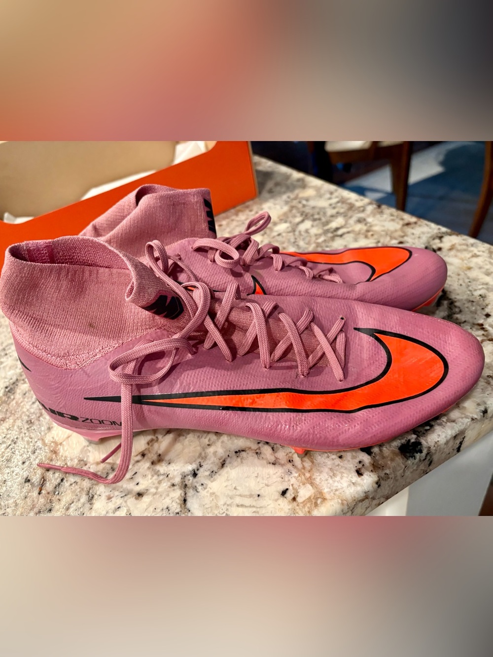 Nike Pink Soccer Cleats with Orange Swoosh